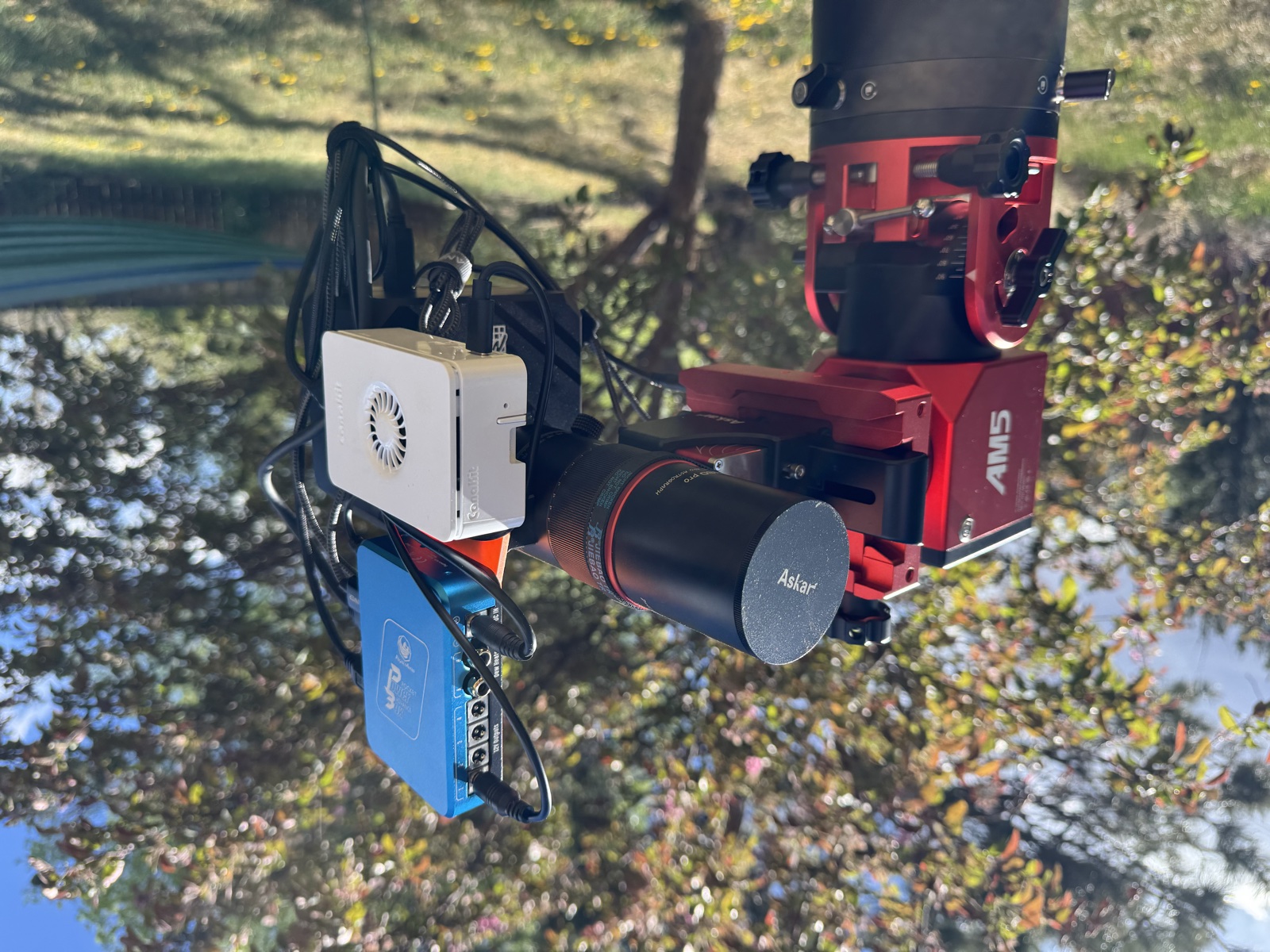 A Raspberry Pi running citrasense-pi mounted alongside an Askar refractor on a ZWO AM5 mount, outdoors in daylight